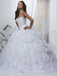 Quinceanera Collection style 26716 with a full cascading ruffle skirt is available in royal, light pink, and white.